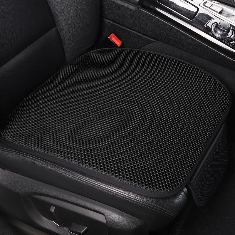 Black breathable ice silk car seat cushion with a red switch visible in the vehicle interior.