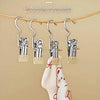 Stainless steel clothespins with hooks hanging laundry on a clothesline