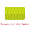 A stack of fluorescent yellow 3x8cm reflective strip stickers for car safety.