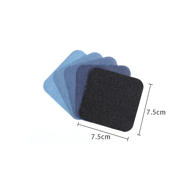 A stack of five dark colored iron-on patches, including black and various shades of blue/gray, showing their size.