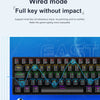 A close-up view of a black wired mechanical gaming keyboard with multiple keys and RGB backlighting, featuring text about wir