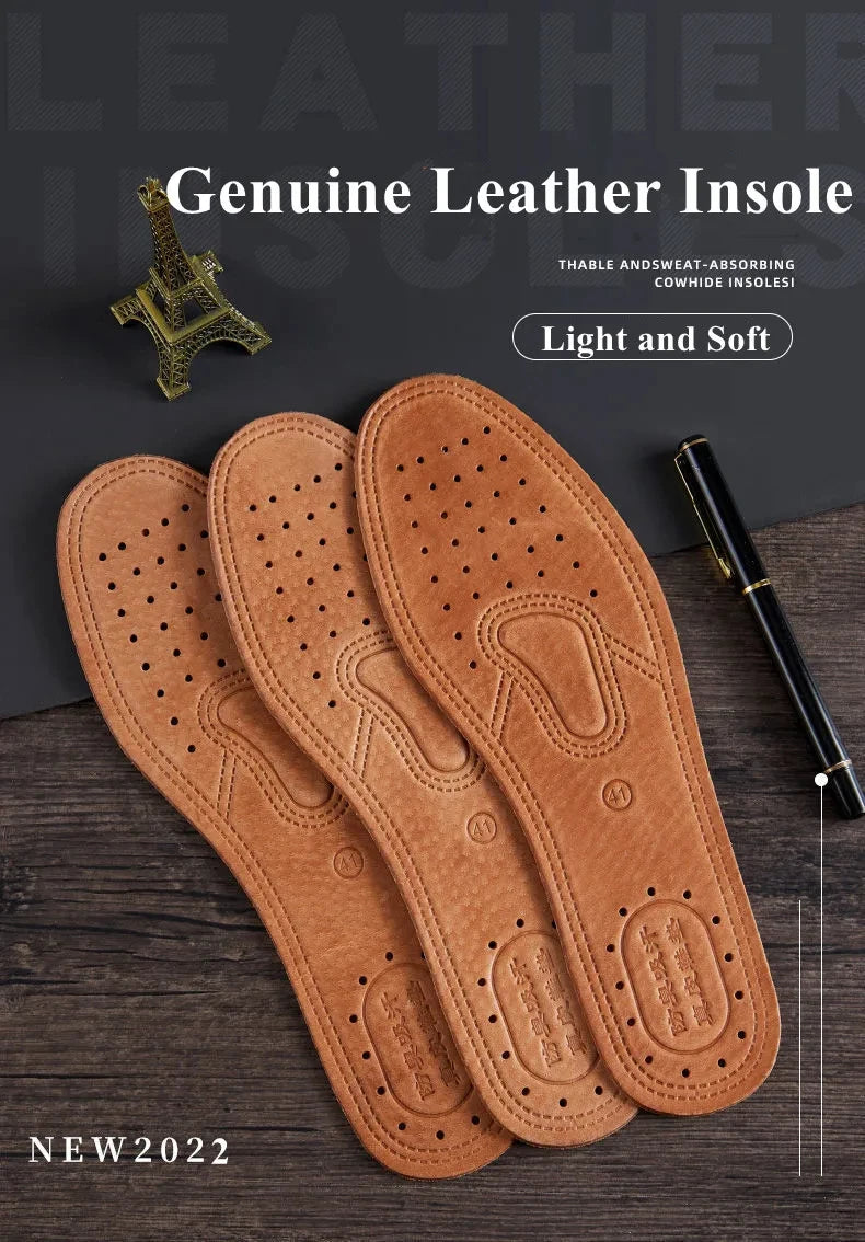 Three genuine leather insoles for men in a tan brown color displayed on a dark wooden surface.