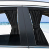 Black fabric sun shade covering a car side window with UV protection against bright sunlight.