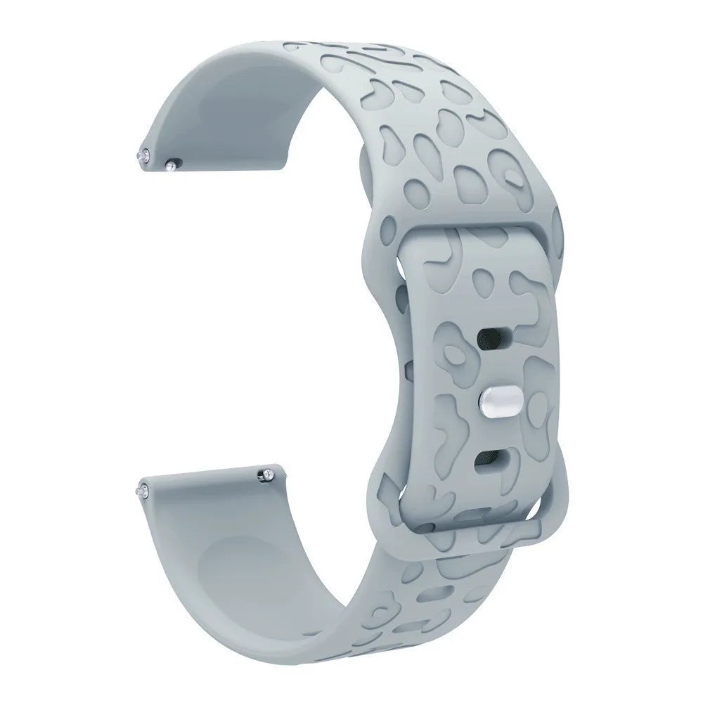 A gray silicone watch band with an engraved pattern is shown from the side.