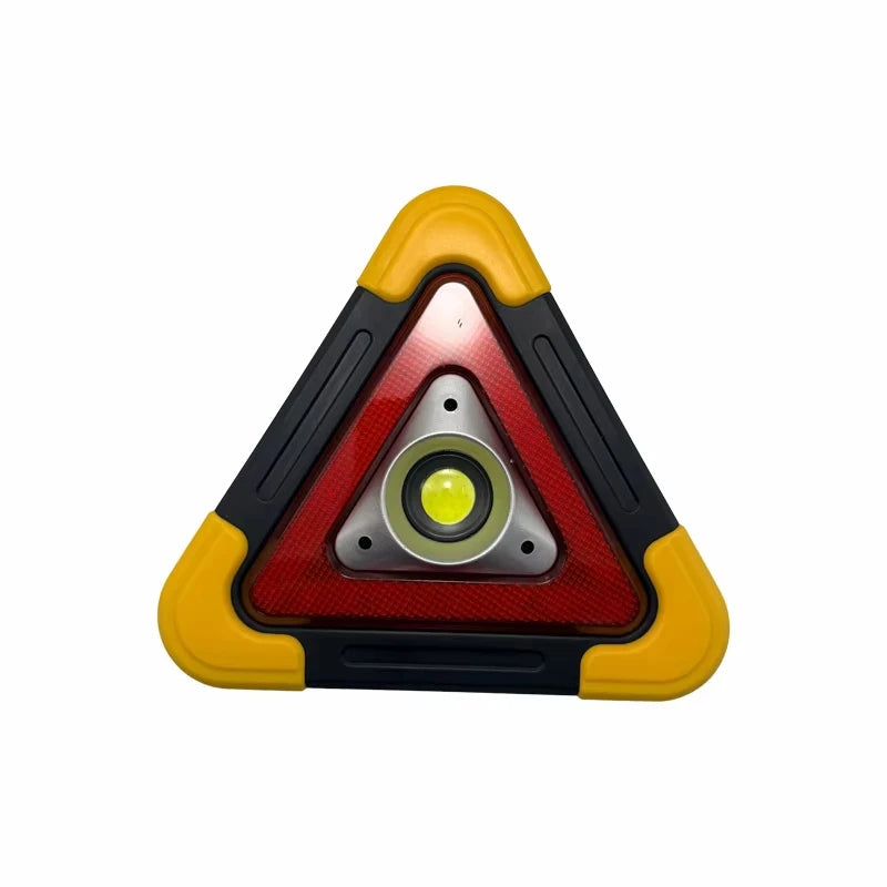 A triangular warning light with a yellow border and red lens, featuring a central flashlight element.