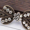 Vintage bronze bowknot clothing clips decorated with clear rhinestones