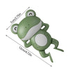 A green wind-up swimming frog bath toy with measuring lines indicating its size.