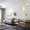 A modern living room featuring a gray sofa, wooden table, and natural light, with self-adhesive matte white vinyl wallpaper v