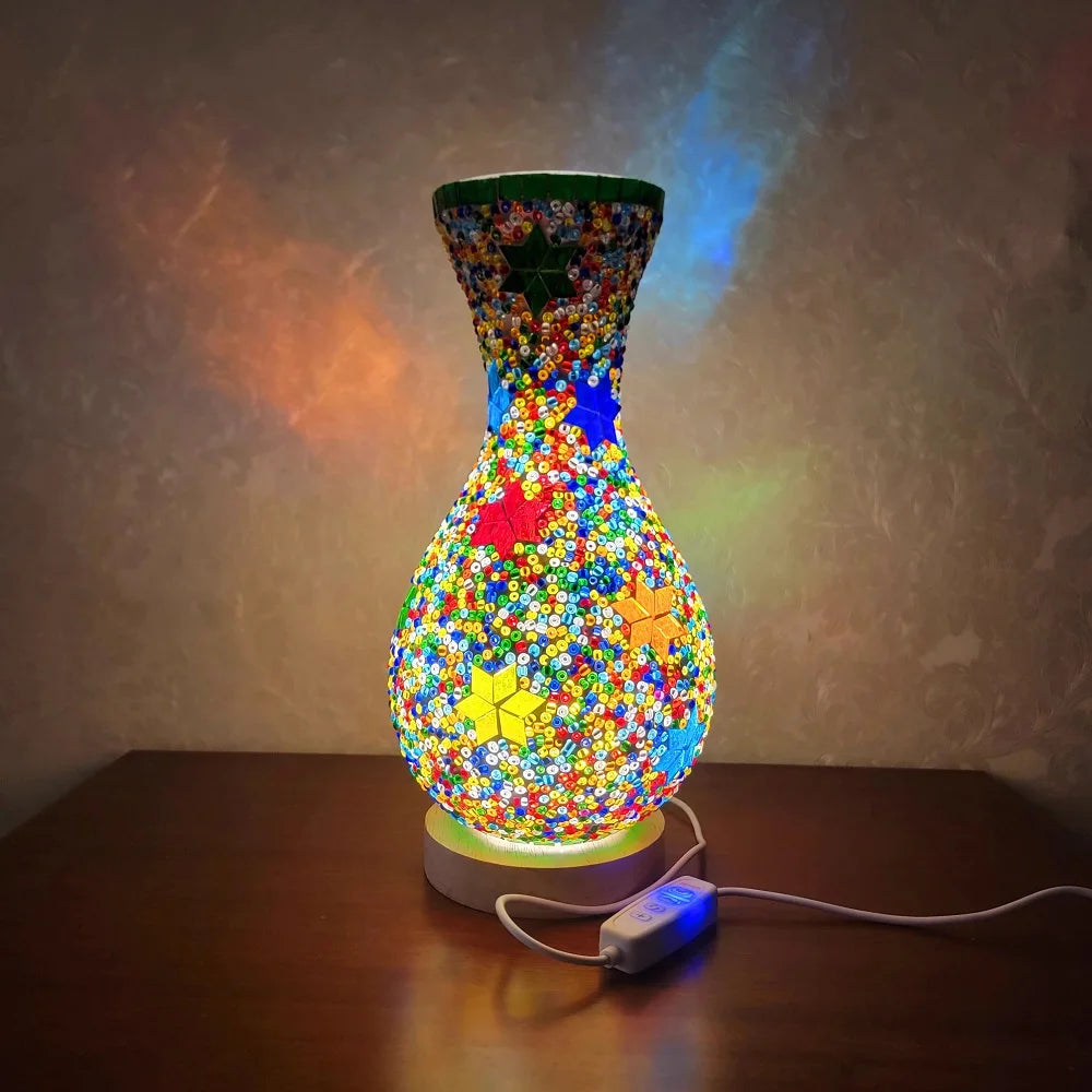 A handcrafted Turkish mosaic table lamp with warm LED glow, featuring vibrant multicolored glasswork.