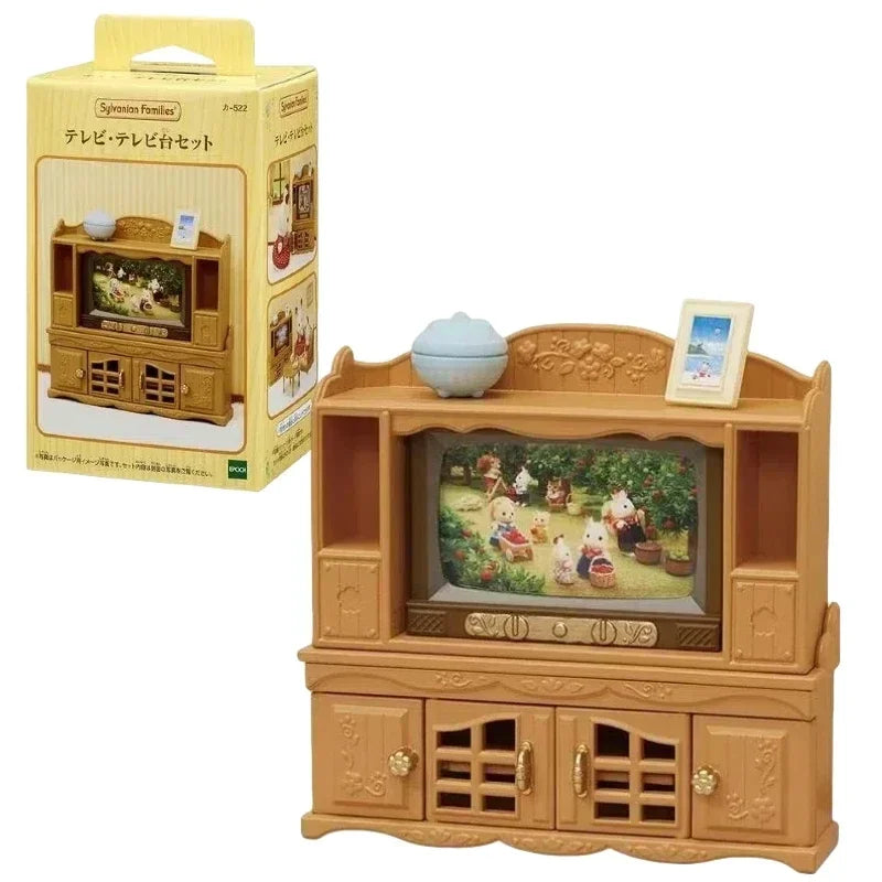 A wooden toy set featuring a television and furniture, part of the Sylvanian Families Forest Friends gift set.