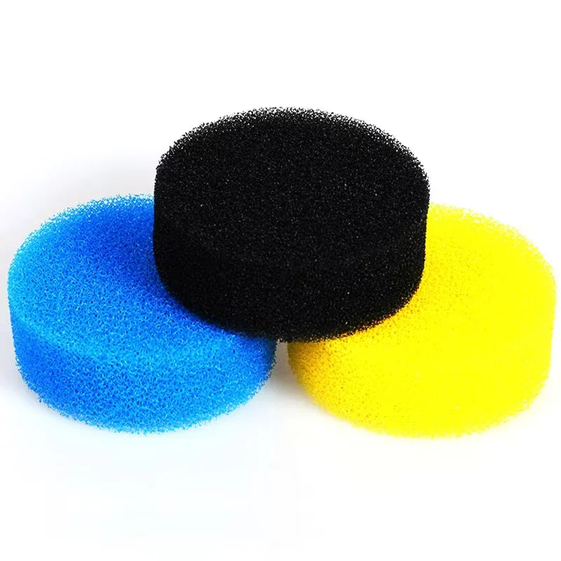 Three spherical replacement filter sponges in black, blue, and yellow for aquarium filters
