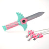 Set of four pink and teal dagger key necklaces with green handles and pink gemstone accents