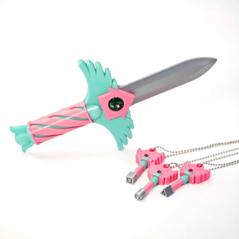 Set of four pink and teal dagger key necklaces with green handles and pink gemstone accents