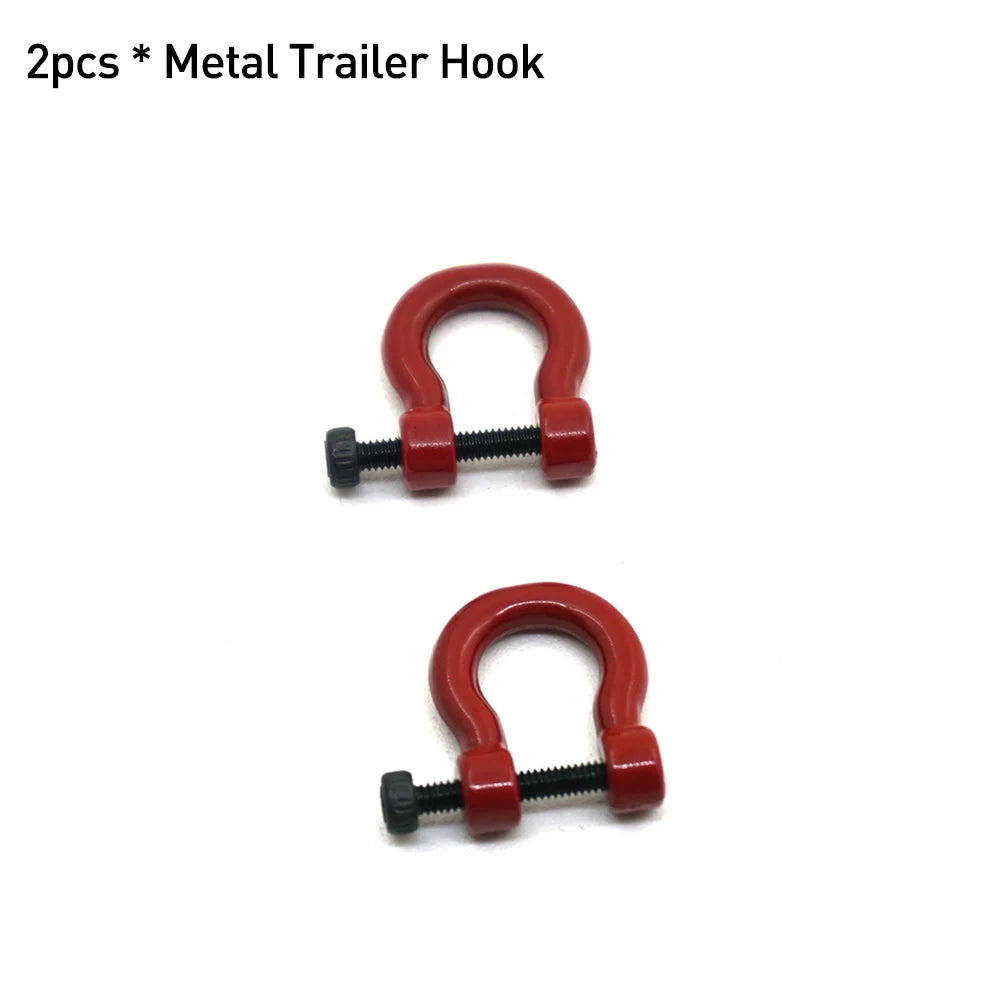 Two red metal trailer hooks for RC crawler decoration.