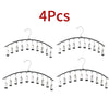 Four sets of space-saving metal pant hangers with ten clips each.
