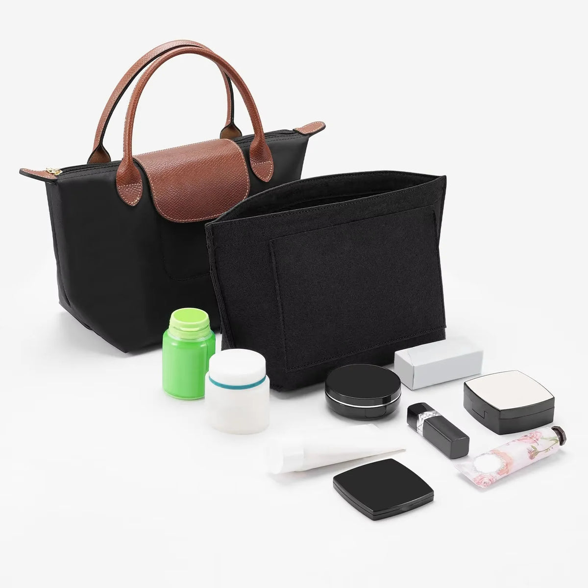 A black felt purse organizer insert is shown next to a brown leather tote bag and various small accessories.
