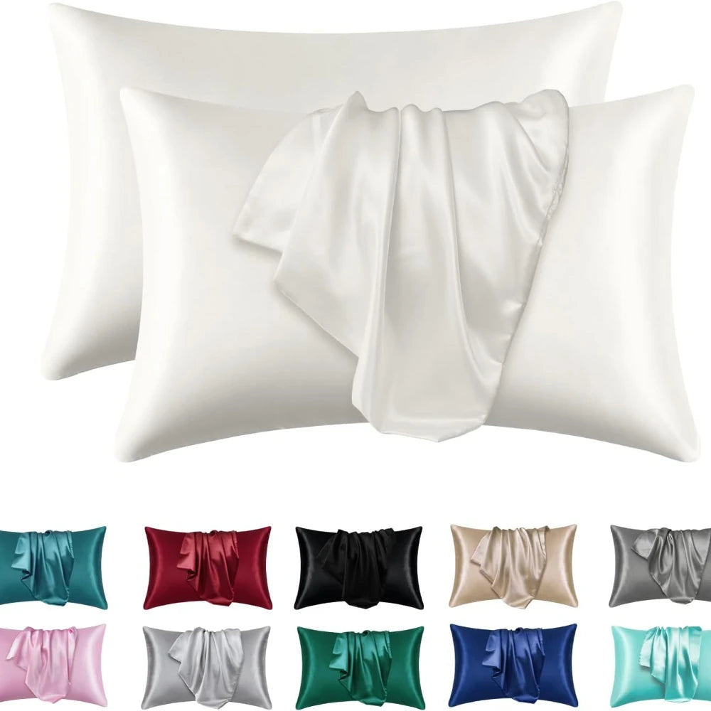 Un juego de fundas de almohada de seda satinada en varios colores, incluyendo coral, rojo, negro, plata y verde.