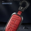A red leather and metal key fob with a black lanyard, designed for 360-degree protection.
