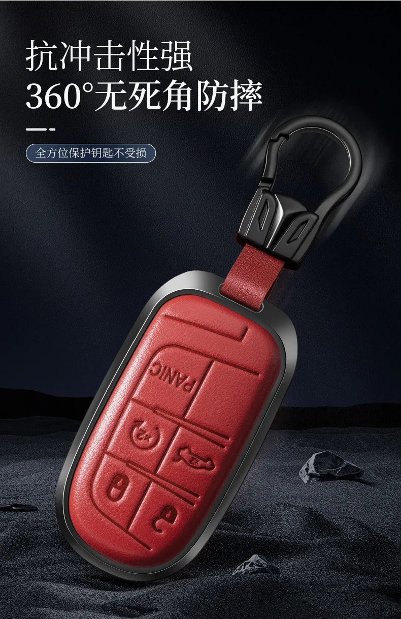 A red leather and metal key fob with a black lanyard, designed for 360-degree protection.