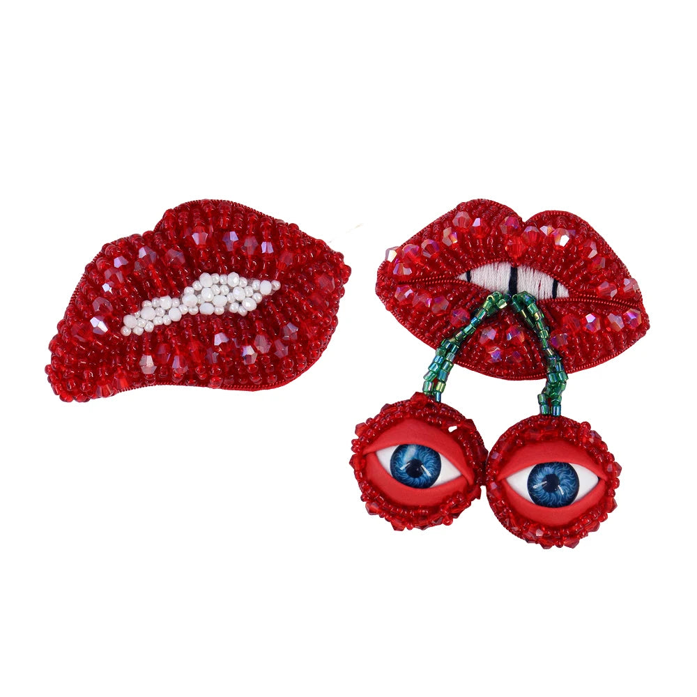 Two sparkling red beaded rhinestone patches shaped like lips and eyes for clothing and DIY crafts