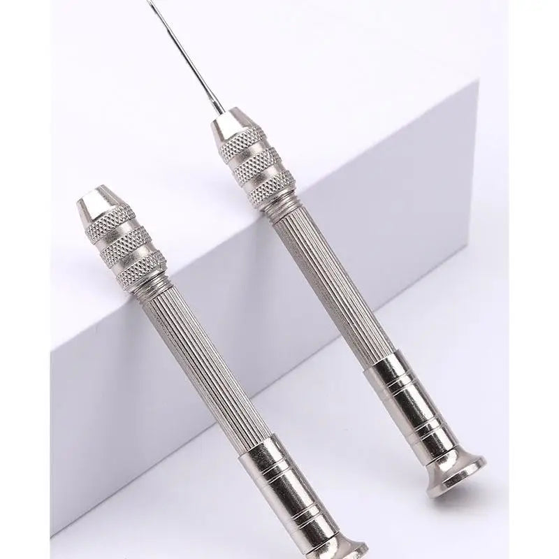 A pair of silver leather sewing awls with replaceable needles shown against a white background.