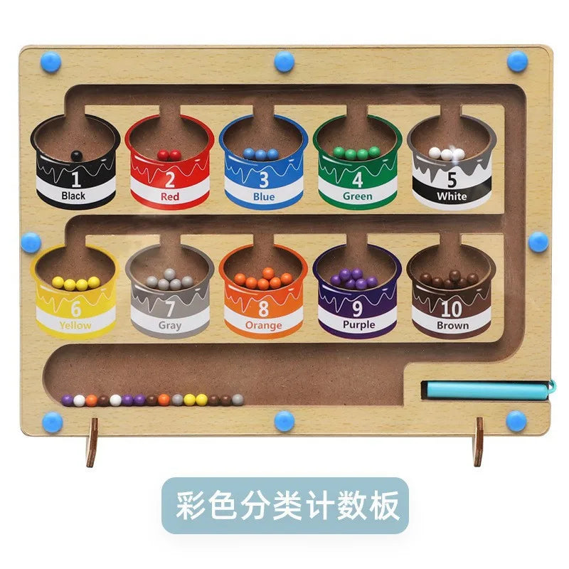 A wooden magnetic color sorting maze board with ten cups labeled 1 through 10 containing colored beads.