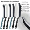 A pack of six multi-functional long crevice cleaning brushes with black and white bristles shown next to a sink.