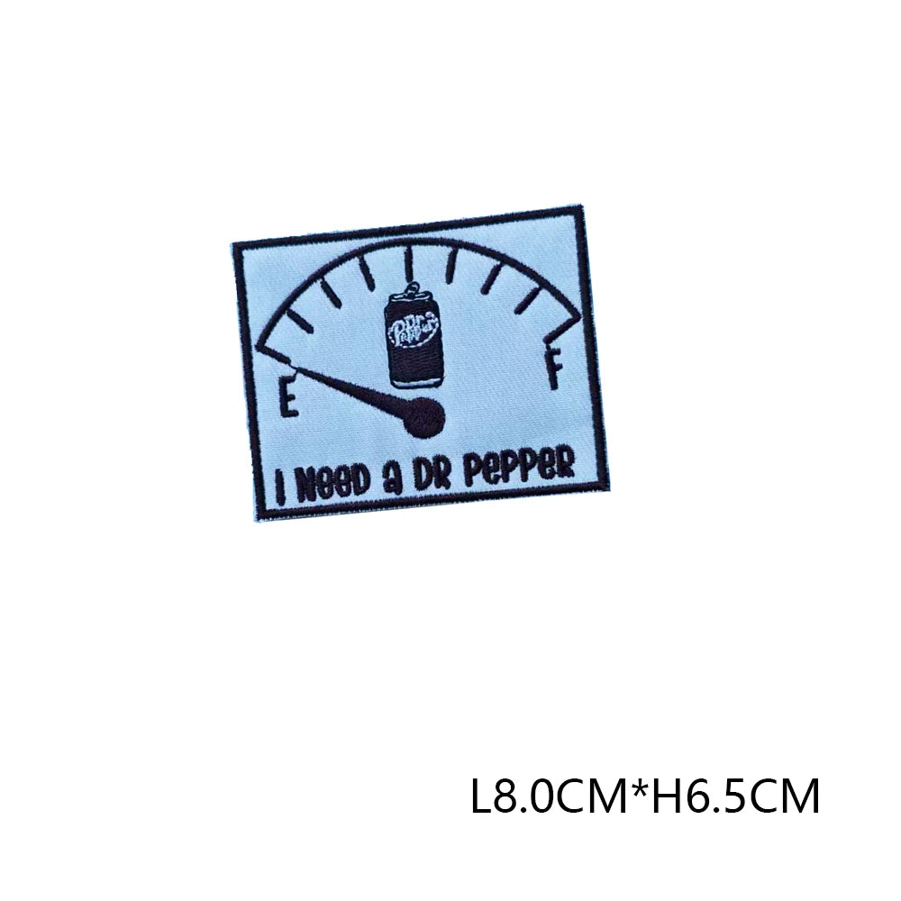 Black embroidered letter patch with a thermometer design and the text I NEED A DR PEPPER