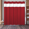 A red shower curtain featuring a geometric stripe pattern hanging on a rod.