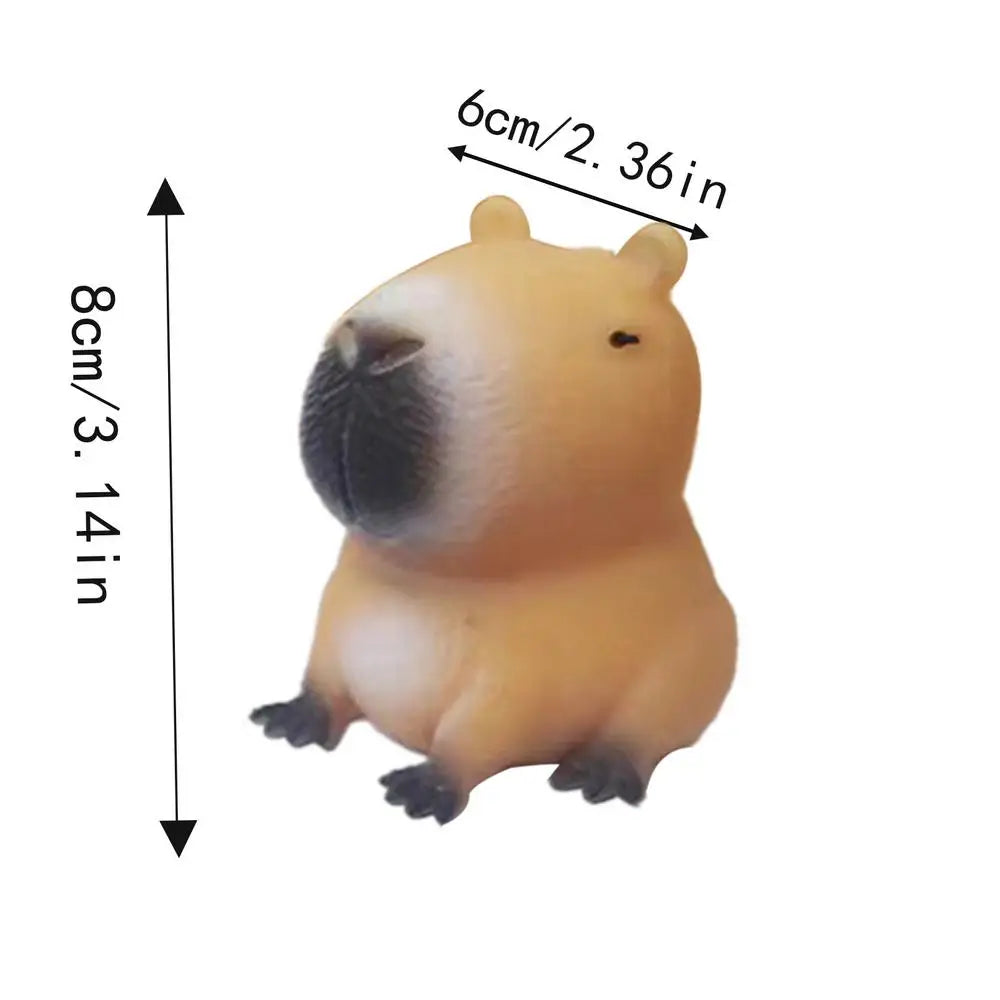 A light brown capybara squeeze toy with rounded features shown from the side.