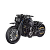 A detailed black motorcycle model kit featuring intricate mechanical parts and components.