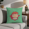 A green pillow featuring a cartoon character with orange hair and large eyes, inspired by Ponyo.