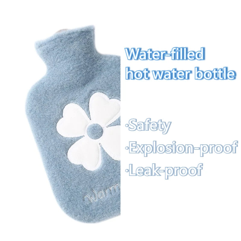 A light blue plush-covered water-filled hot water bottle with a white flower design.