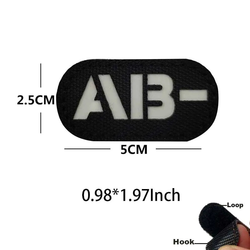 Black glow-in-the-dark blood type tactical patch with hook and loop backing