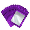 A stack of purple Mylar ziplock bags with clear windows for jewelry and small item packaging.