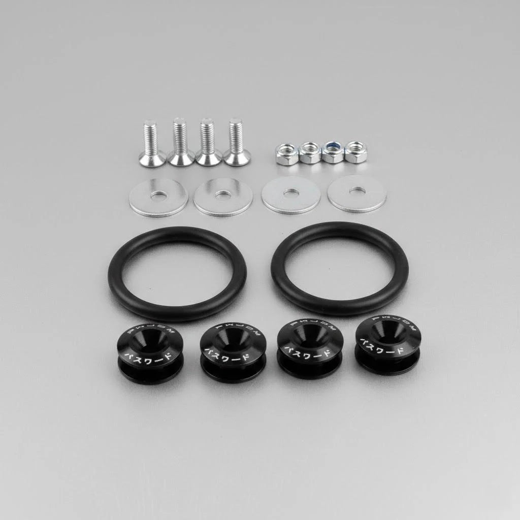 A collection of metal fasteners and rubber bumpers for car body panels.