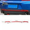 Red interior and exterior trim kit for a Chevrolet Camaro featuring a blue license plate area.
