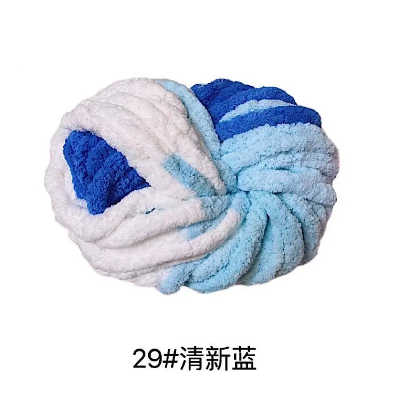 A ball of chunky acrylic yarn featuring blue and white stripes.