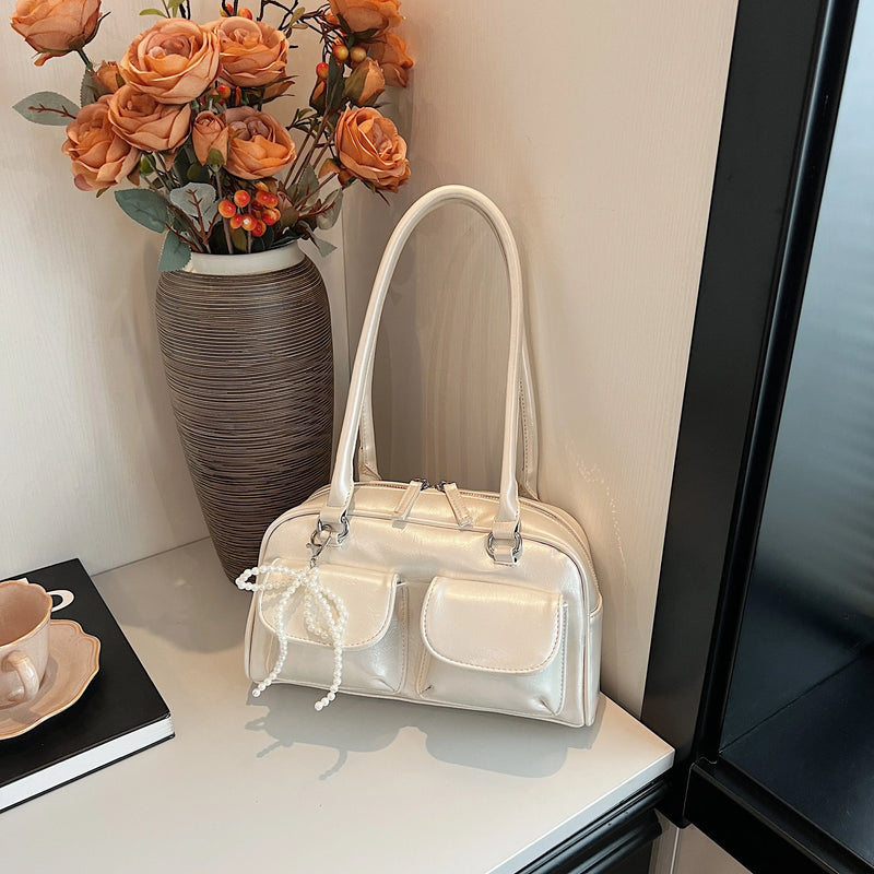 Bolso de hombro suave con detalle de lazo
