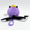 A cute purple plush doll with a yellow crown and black wings, displayed against a white background.