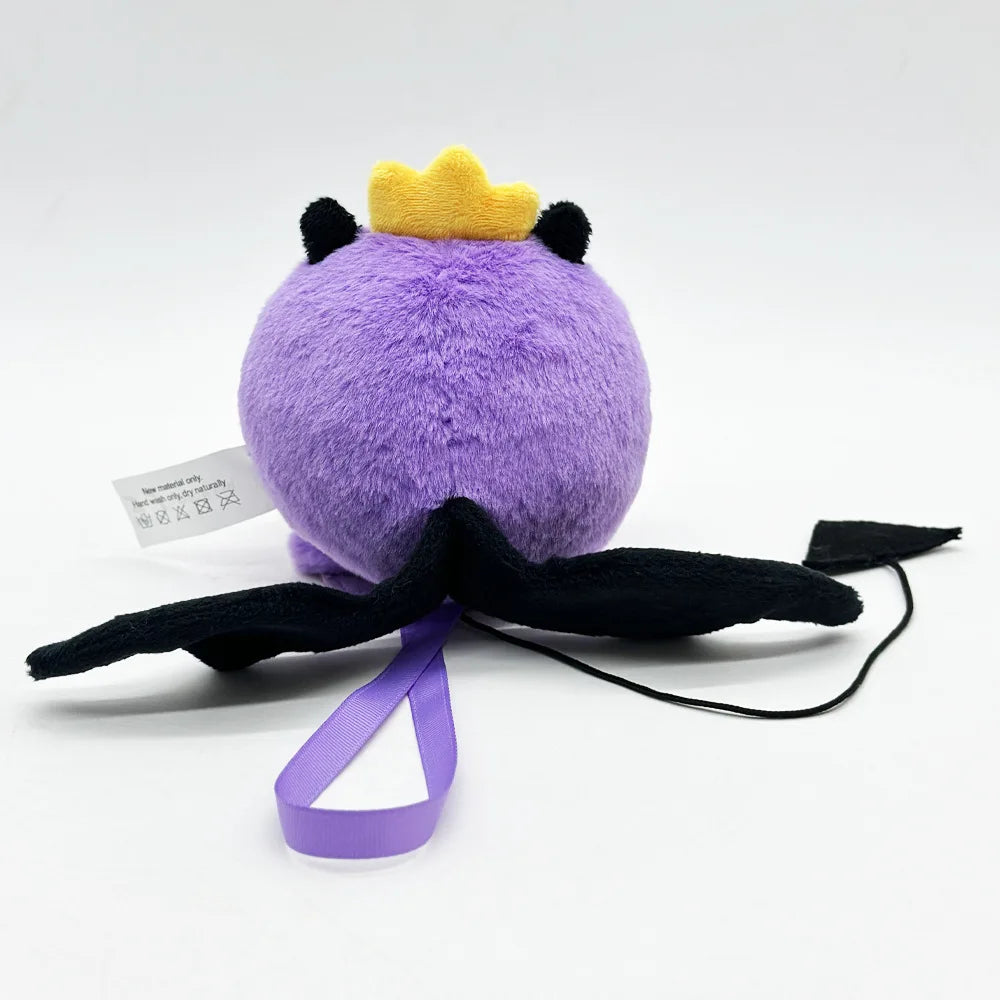 A cute purple plush doll with a yellow crown and black wings, displayed against a white background.