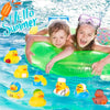 A child is floating on a green inflatable duck toy surrounded by several yellow and blue rubber duckies in water.