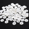 A pile of 100 white acrylic pearl spacer beads for jewelry making