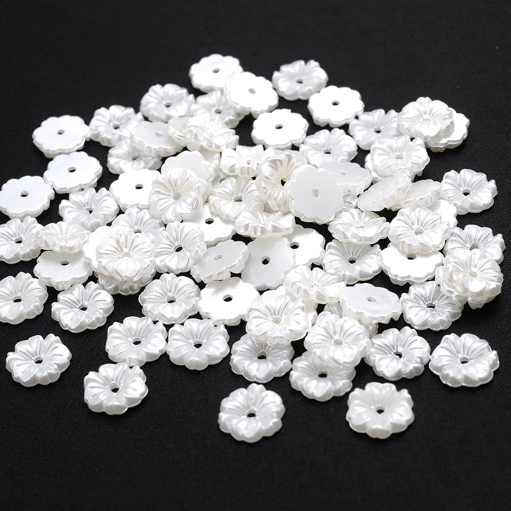 A pile of 100 white acrylic pearl spacer beads for jewelry making