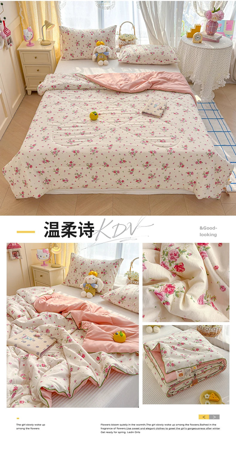 A pink floral quilt with a yellow cartoon bear design displayed on a bed.
