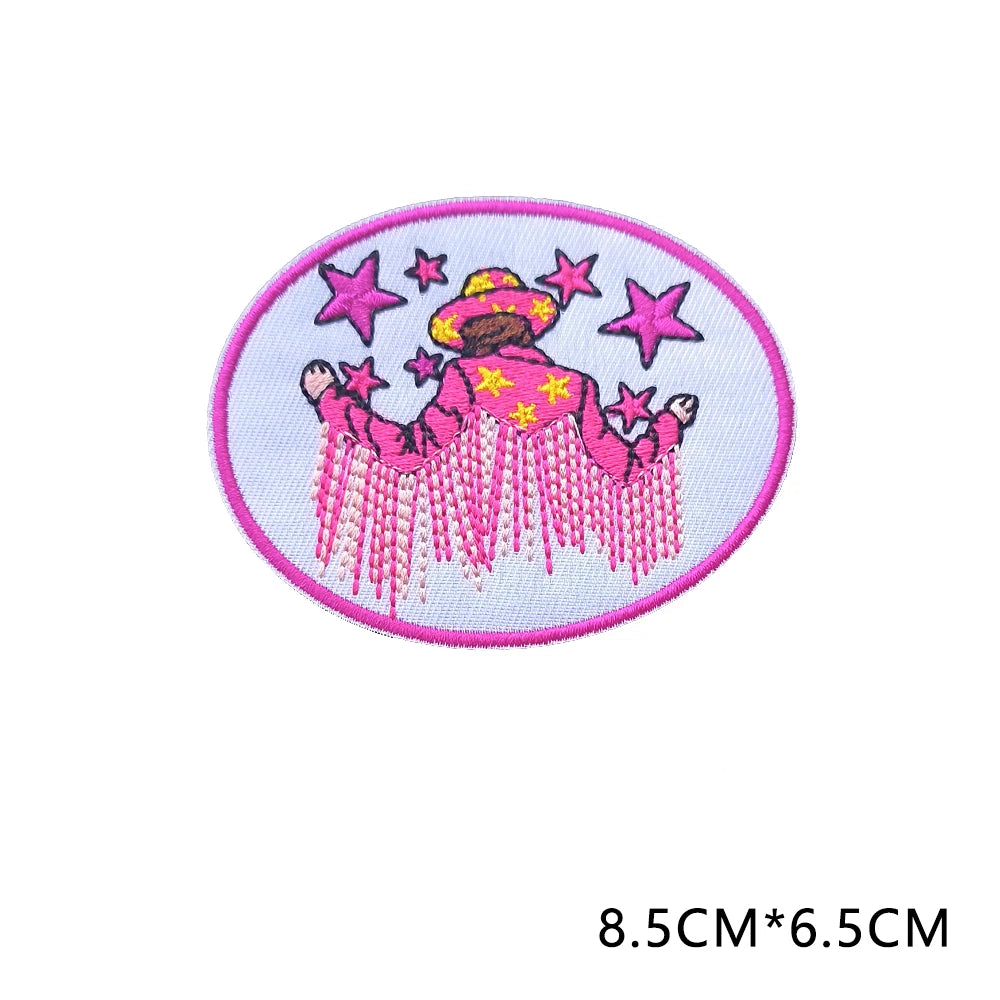 Pink embroidered patch featuring a woman with a sombrero and stars