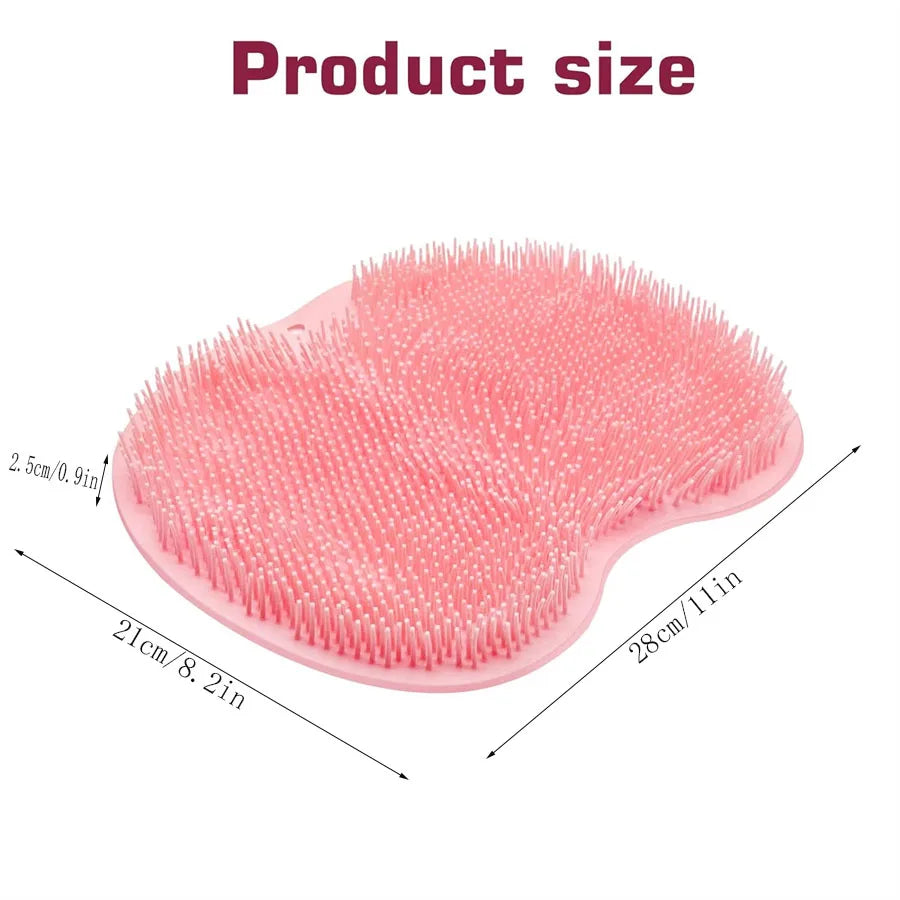 Pink silicone shower scrubber with numerous bristles and suction cups shown from above.