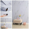 Rolls of self-adhesive 3D wood grain wallpaper panel showing application and texture.