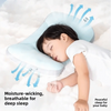 A baby is sleeping comfortably on a light blue moisture-wicking pillow for deep sleep.