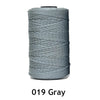 A spool of 1.5mm fine gray polyester thread for knitting and DIY crafts.
